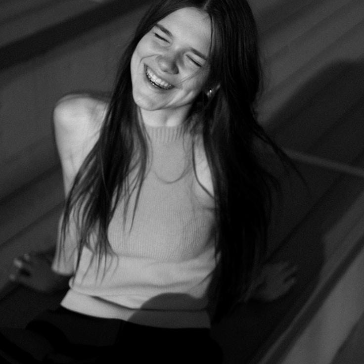 Avery Chen, Lead Design Curator at Clear Harbor Matrix, reviewing corporate floral arrangements